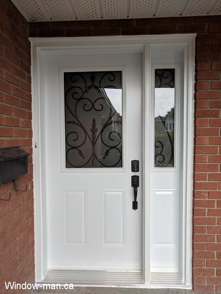 Single entry insulated steel front exterior door with one sidelite. Half a glass. White door. South Port classic iron glass
